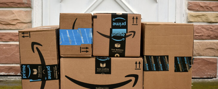 Stacked Amazon boxes on a front porch